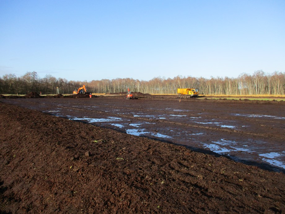 Construction equipment working on building a polder