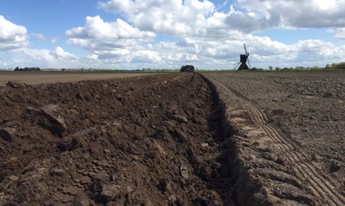 Ploughing to form a bank